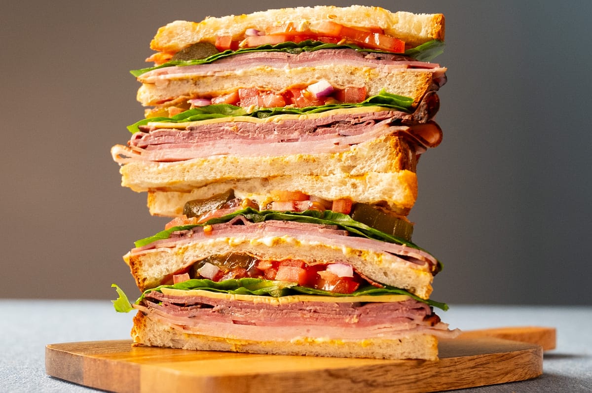 The Hawkinator club sandwich from Arble Baking Company, stacked high with roast beef, ham, lettuce, and tomato on fresh bread