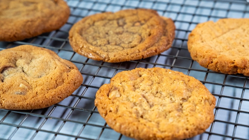 An assortment of fresh-baked Arble cookies cooling on a wire rack