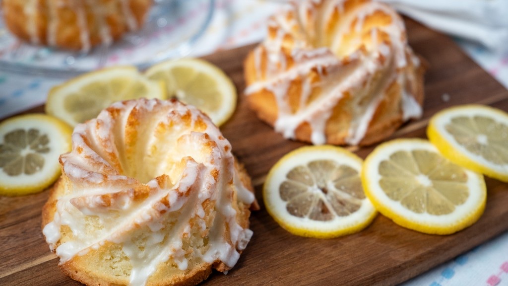 Glazed mini lemon Bundt cakes arranged with fresh lemon slices